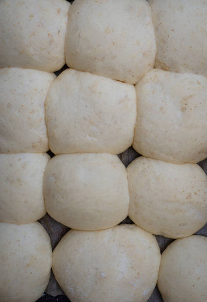 istock Bread dough  on floured board ,making bread rolls at home. 1297753273