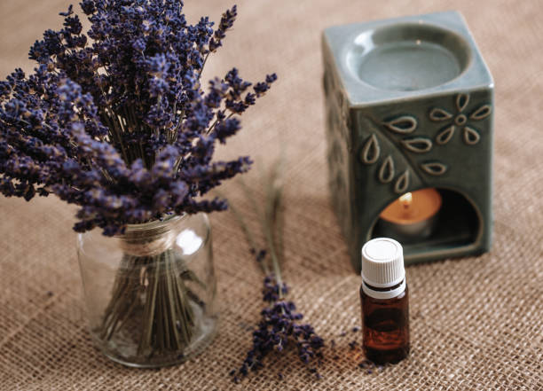 istock Aroma lamp with a burning candle and essential oil, background with copy space 1297753665
