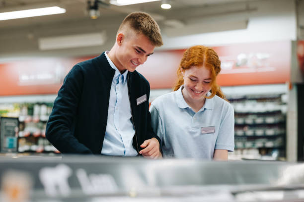 istock Trainees working together in grocery store 1297755043