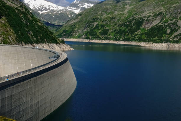 istock hydroelectric power plant with a huge dam and blue water 1297758541