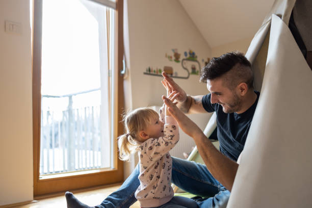 istock Father having fun in kid's room 1297759675