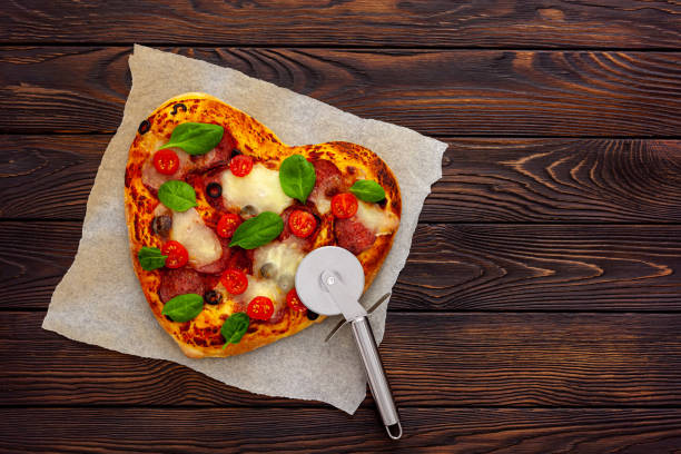 istock Heart shaped pizza for valentine's day 1297760029