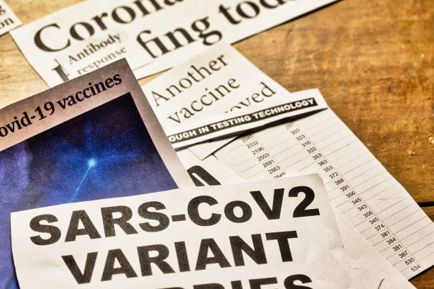 istock Newspaper headlines about COVID-19 pandemic 1297760245