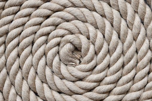 Navy rope folded in circle closeup background top view