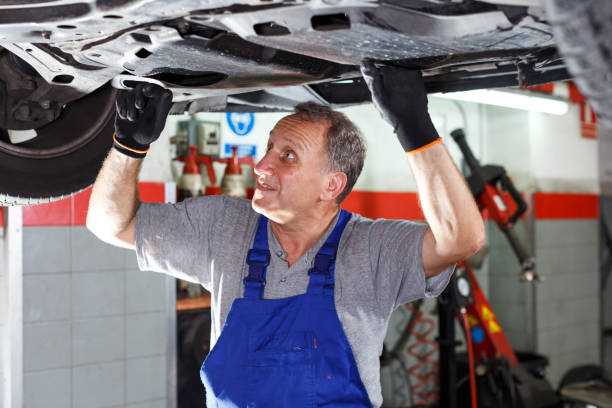 istock Mechanician repairing car 1297762431