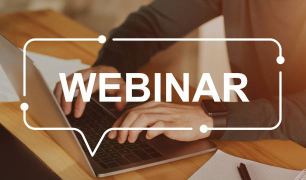 istock Webinar inscription over unrecognizable businessman using laptop 1297763366