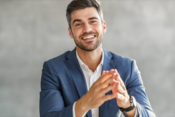 istock Happy male entrepreneur talking during conference call. 1297763992