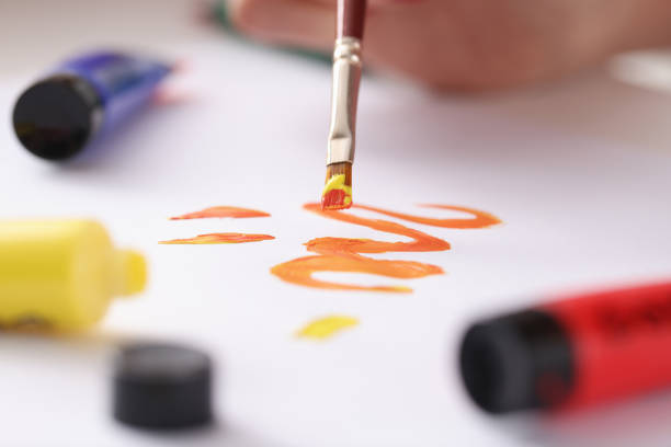 Draw drawing on sheet with brush. Drawing courses for adults concept