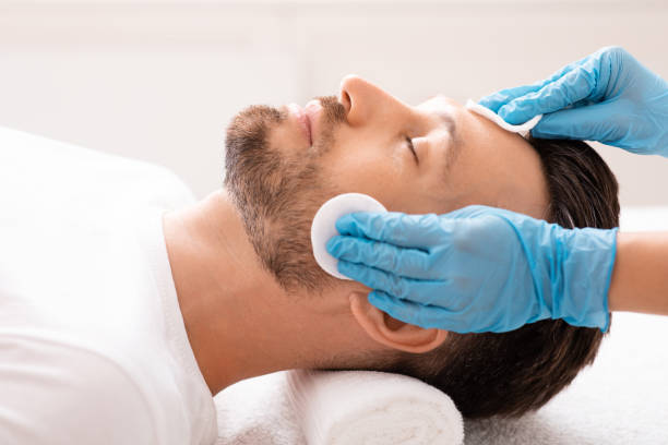 istock Middle aged man visiting beauty clinic, face care concept 1297765512