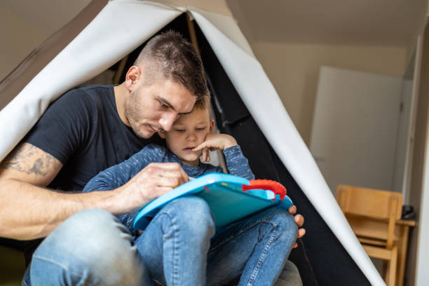 istock Playfull father having fun in kid's room 1297765746