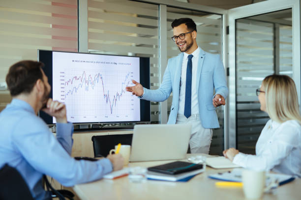istock Businessman leading presentation in meeting room 1297767130