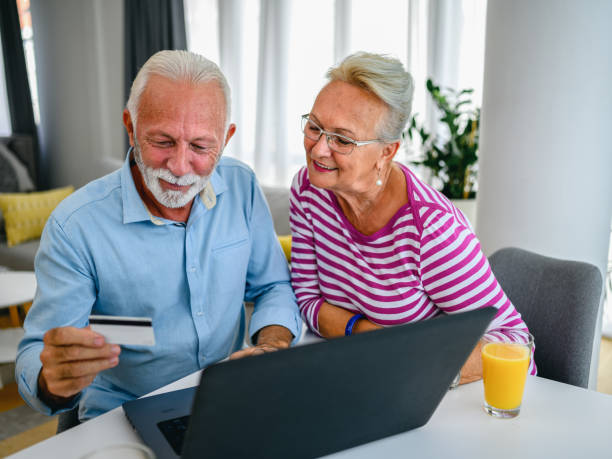 istock Senior couple doing some online shopping 1297767309