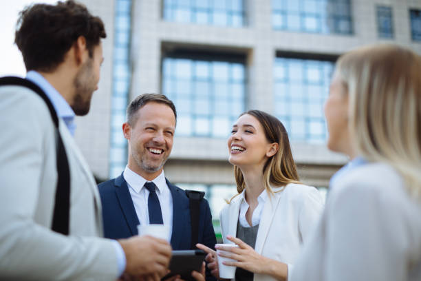 istock Group of managers collaborating on project using digital tablet outdoors 1297767426