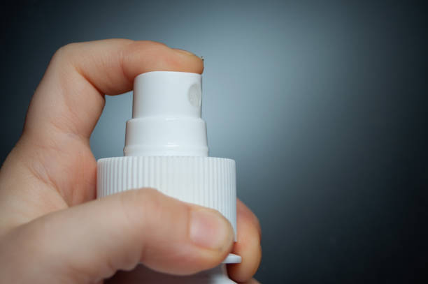 istock sprayer in hand close up, disinfectant 1297768734