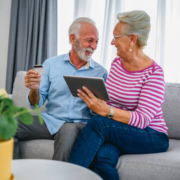 istock Senior couple doing some online shopping 1297770115