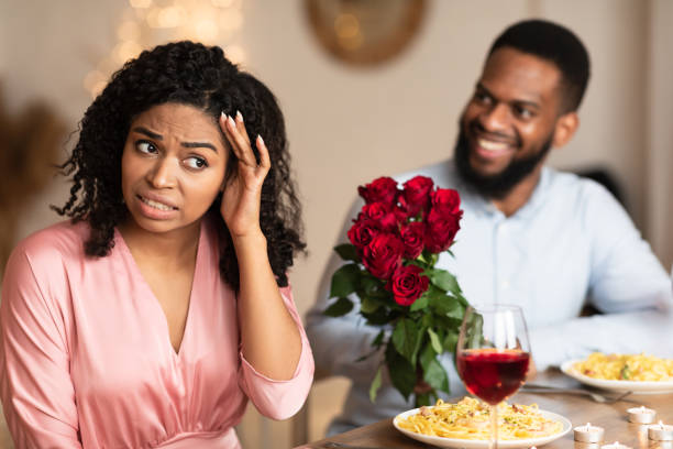 istock Black Couple On Unsuccessful Blind Date In Restaurant 1297770303