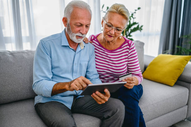 istock Senior couple doing some online shopping 1297772009