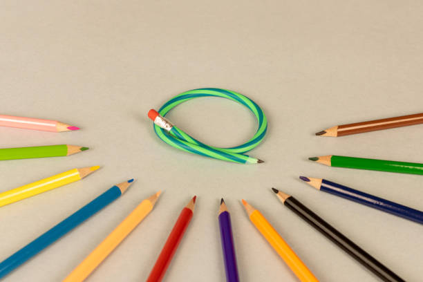istock Multicolor pencils and flexible pencil on a light background. Close up. Selective focus. 1297772359