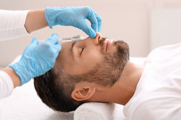 istock Middle-aged businessman getting injection in his nose 1297773057