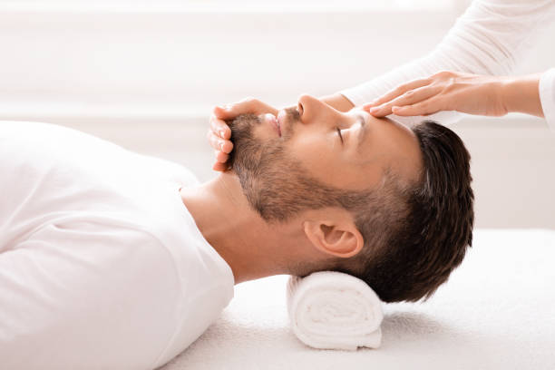 istock Spa therapist making relaxing massage for handsome middle-aged man 1297773070