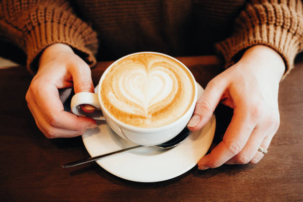 istock Girl working on a smartphone in a cafe 1297773736