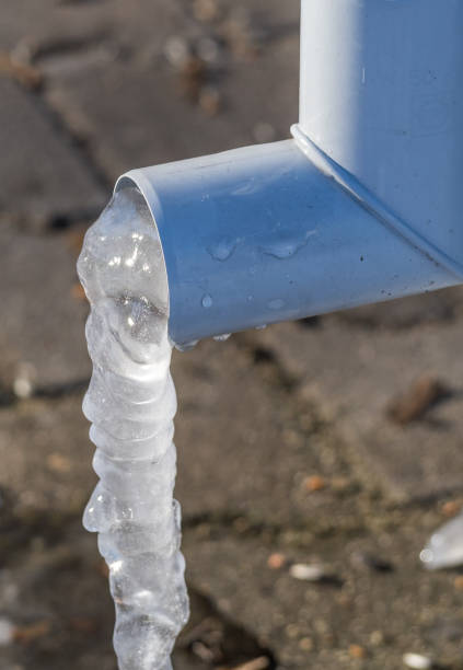 istock Roof Gutter with ice frost 1297777784