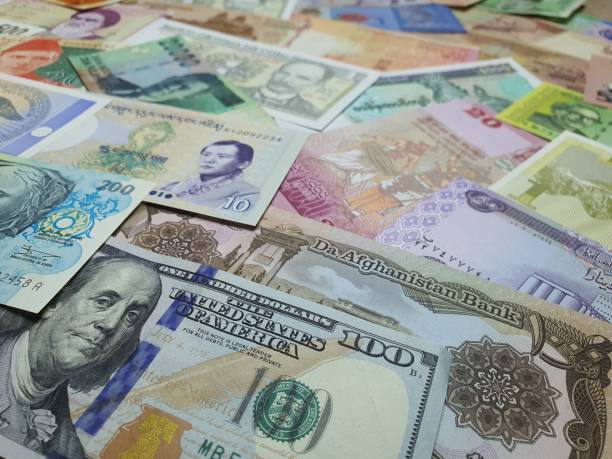 istock Several countries banknotes are merged together to exchange money between countries.Use for website, banner, background and backdrop. 1297783157