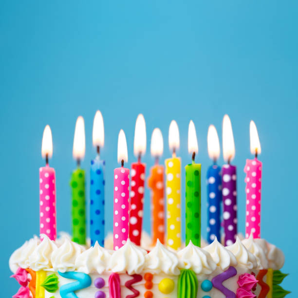 istock Brightly colored birthday cake candles 1297783283
