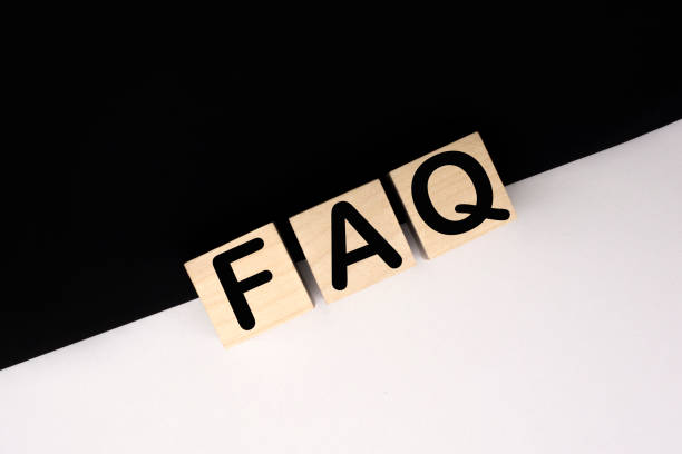istock Wooden blocks with word FAQ on black baclground. Frequently asked question concept 1297786233