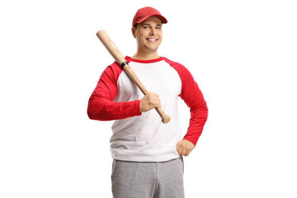 istock Man holding a baseball bat and smiling at camera 1297787166