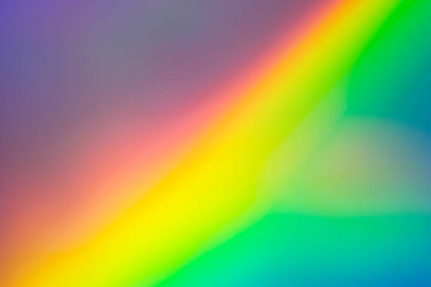 istock Blurred bright diagonal rainbow light refraction overlay effect for mockups. Organic diagonal holographic flare on a light wall Shadows for natural light effects. Trendy creative gradient 1297787562