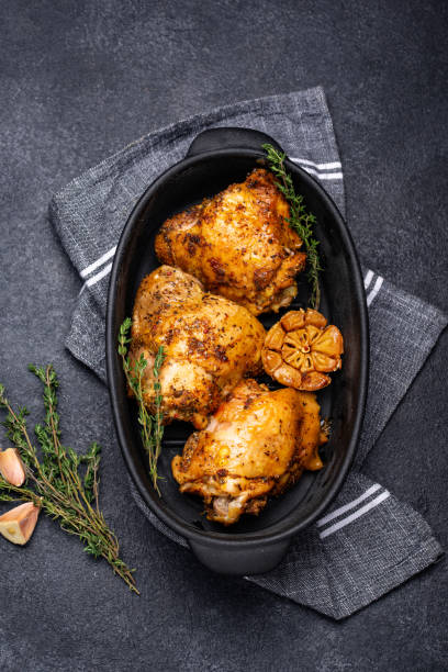 istock Grilled chicken thighs with garlic 1297790240