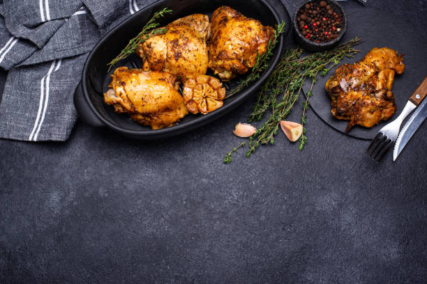 istock Grilled chicken thighs with garlic 1297790267