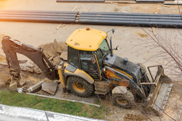 istock The excavator is working on a construction site, digging up the soil for laying pipes. Top view, horizontal photo. 1297794331