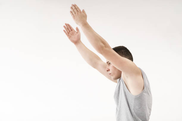 Young beautiful male  ballett dancer posing in studio