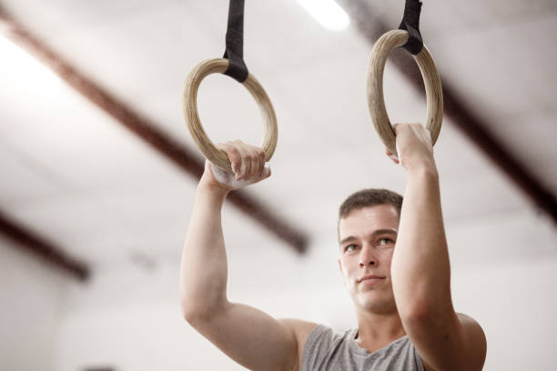 istock Male athlete holding gymnastic rings 1297795458