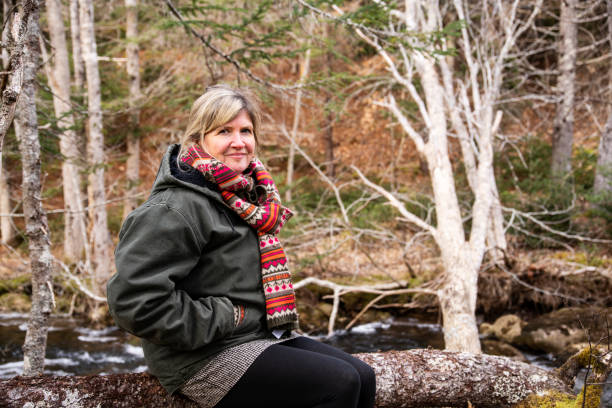 istock A mature woman with a calm, content expression. 1297797076