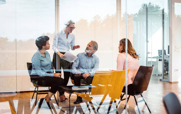 istock Business people having a discussion 1297798052