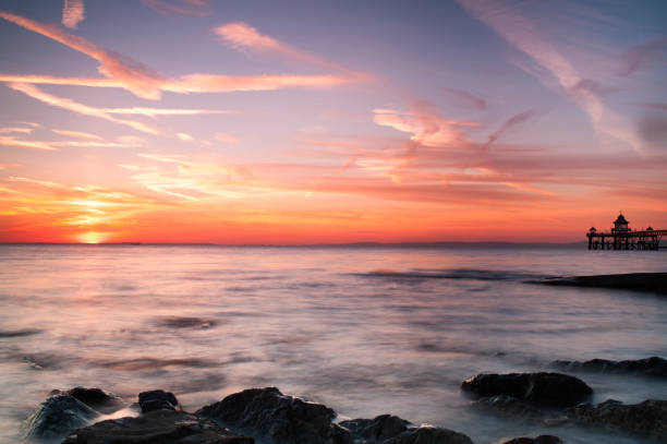 istock Sunset over the sea at Clevedon Pier 1297800375