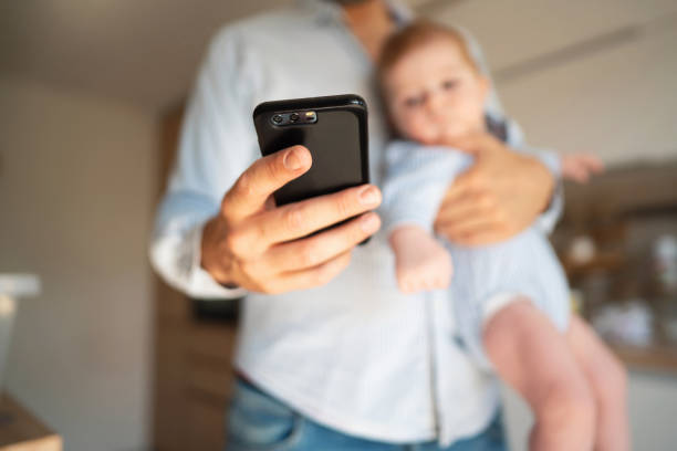 istock Close-up of a man's hand using a smart phone 1297800767