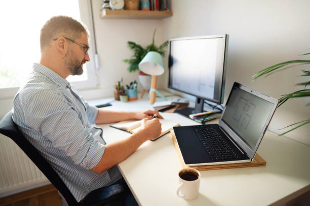 istock Caucasian ethnicity man working on a new projects at his home office 1297800778
