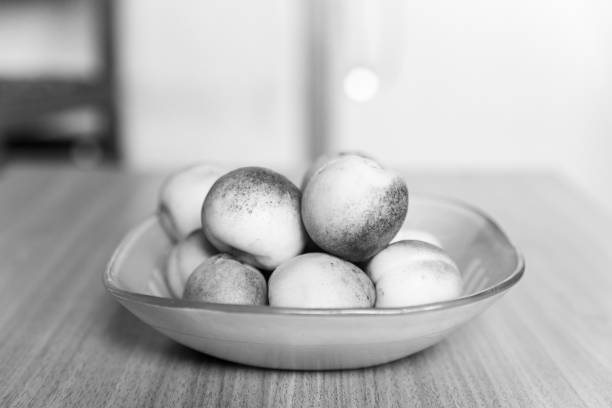 Ripe bright apricots on a table in a plate