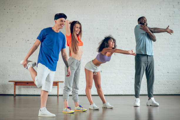 istock Group of young people in sportswear in studio 1297804472
