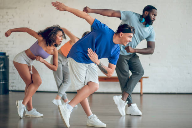 istock Young dancers rehearsing together in dance studio 1297804562
