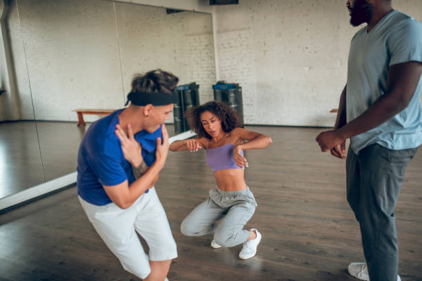 istock Guy and girl dancing energetically at rehearsal 1297804590