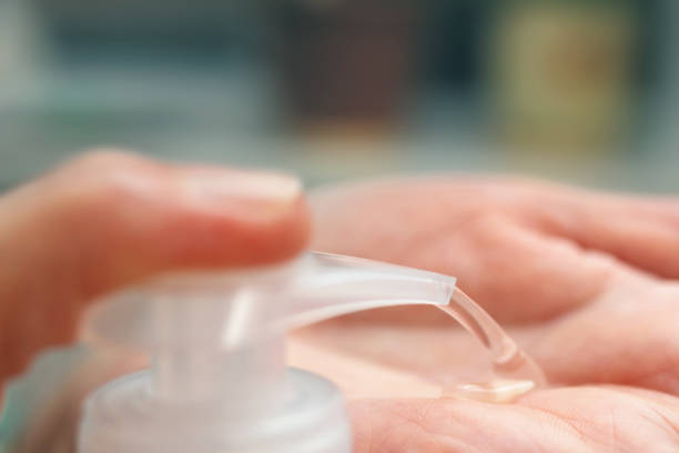 istock Hands using sanitizer gel for disinfection and prevent coronavirus, Covid-19 infection, cleaning palms with antibacterial antiseptic, close-up view 1297807345