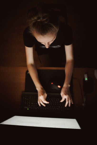 istock Girl working at the computer in home interior. 1297814655