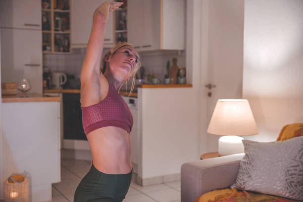 istock Woman practices yoga at home 1297814667