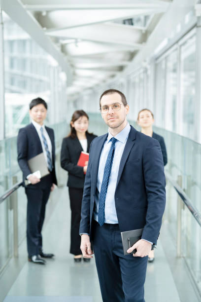 istock Businessman and his business team 1297817707