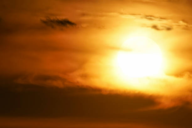 istock Blurred dramatic sunset with clouds that the sun paints in orange. Soft focus, motion blurred. Cloud image design, replacement in photo editor. 1297818629